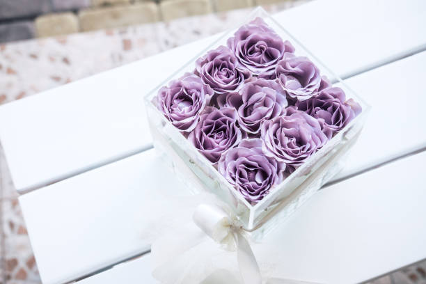 istock Pastel purple roses in clear acrylic box 1029500992