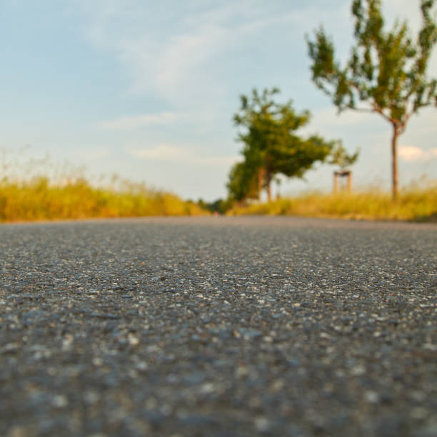 istock asphalt road from a very low perspective 1029506812