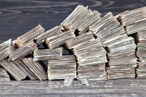 stacks of folded paper money worn and worn out, ready for disposal and destruction