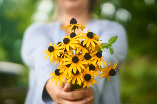 istock A Woman Holding A Bouquet 1029511658