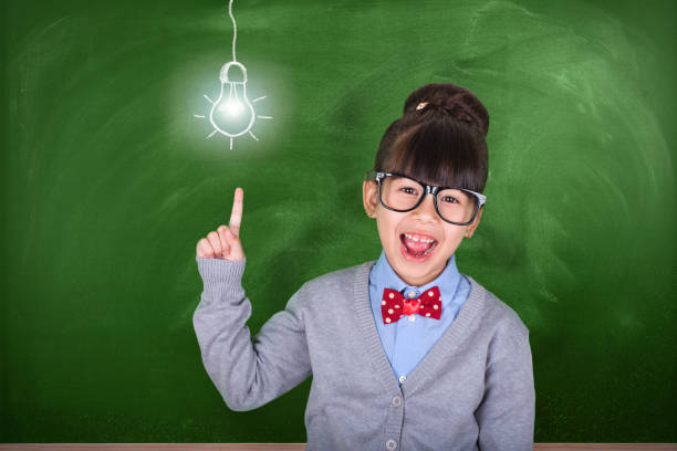 istock Little Asian teacher showing school education concept 1029534616