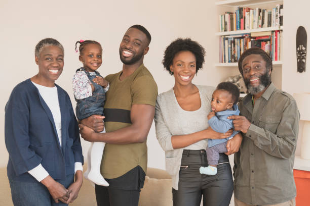 istock Multi generation African family smiling towards camera 1029554662