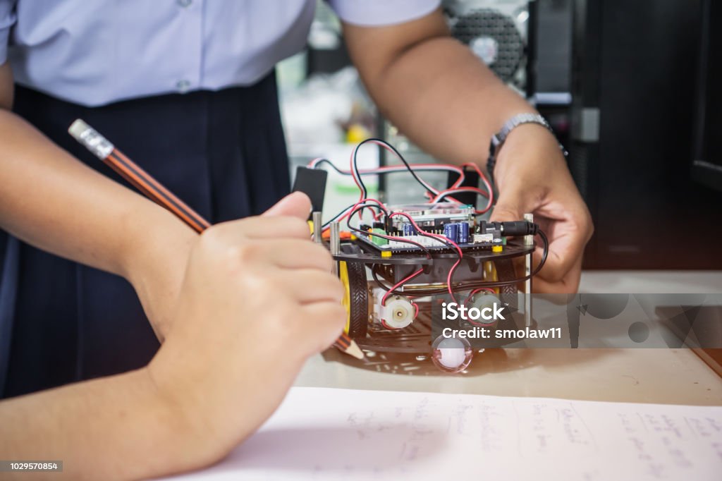 Student learning STEM Education robotics for creating project based studying for innovation robot model. New study generation for DIY electronic Kit in computer teachnology classroom Learning Stock Photo