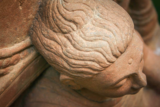 Close up of Buddha statue carved sandstone