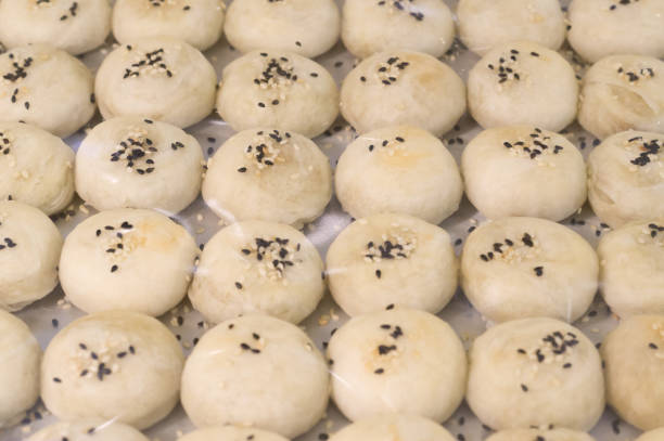 istock White Chinese pastry with balck sesame topping 1029602356