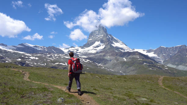 istock Young Hiker in Alpine Mountains with Room For Text 1029613964