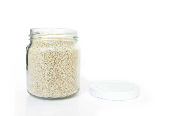 istock white sesame seed in jar on white background 1029616376