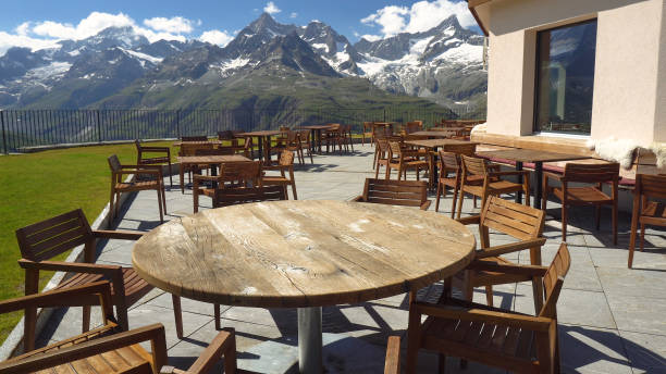 istock Empty Restaurant Tables and Chairs On Top Deck in Mountains 1029619164