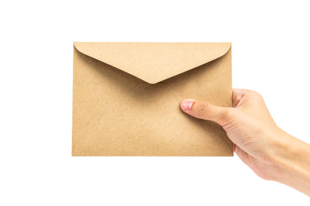 istock hand holding brown envelope isolated on white background 1029622526