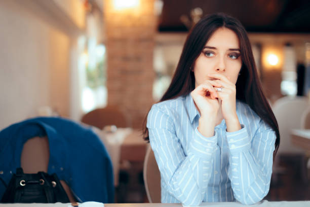 istock Sad Woman Removing Wedding Ring Thinking about Divorce 1029635464