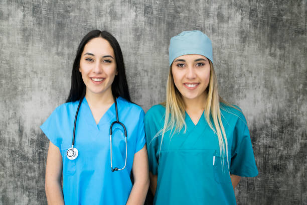 istock Pretty nurse in uniform smiling at camera 1029640462