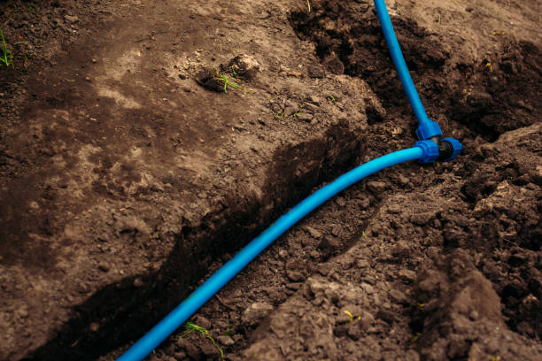 istock Watering hose laid in the ground 1029640630