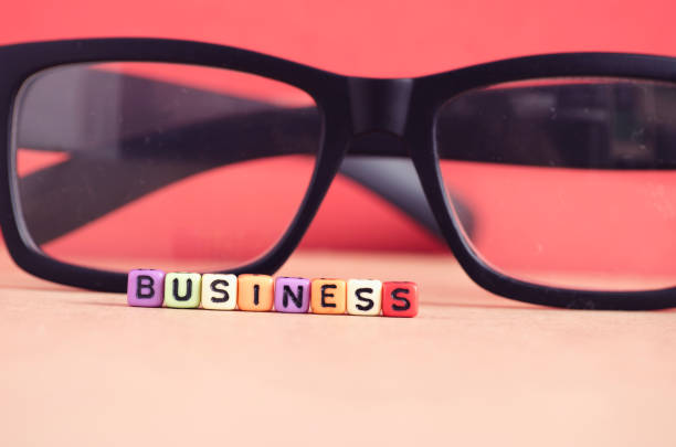 istock colorful BUSINESS word cube on red background 1029645904