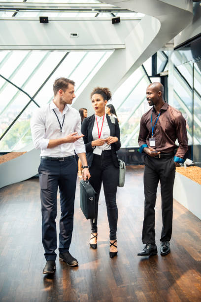istock Business People Walking Through the Corridor 1029650252
