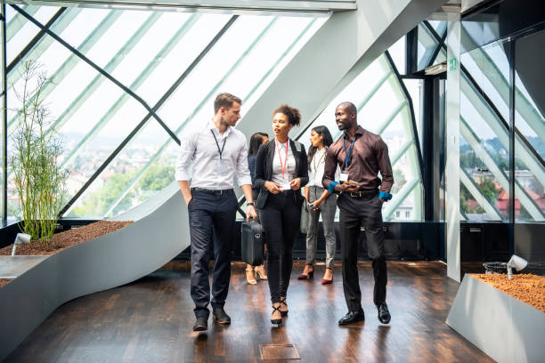 istock Business People Walking Through the Corridor 1029650296
