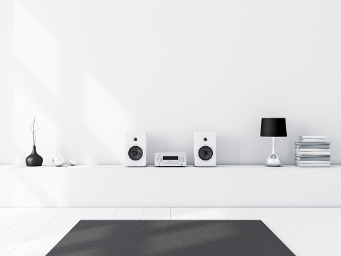 White blank wall mockup with Modern audio stereo system and white speakers on bureau in modern interior, 3d rendering
