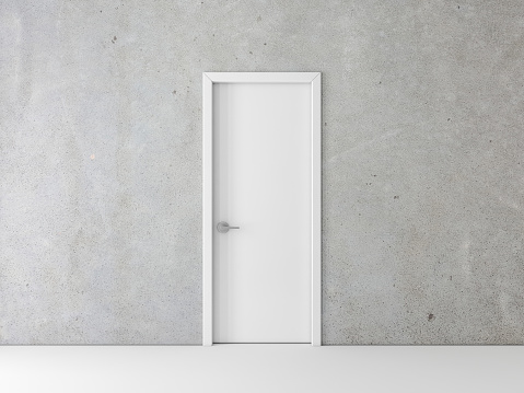 Cerrado blanco puerta en muro de hormigón photo