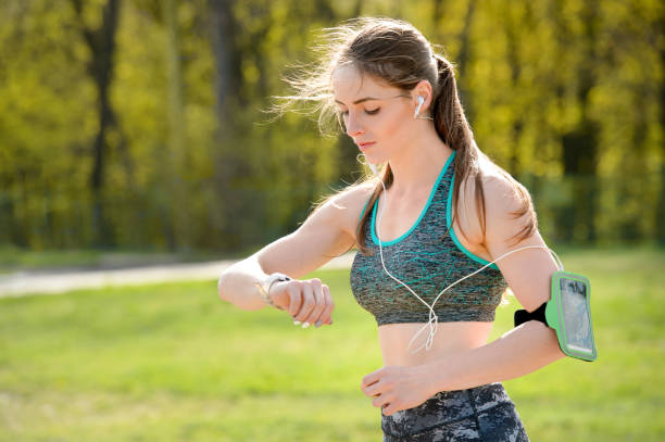 istock Woman checking progress on smart watch after training outdoors 1029654044