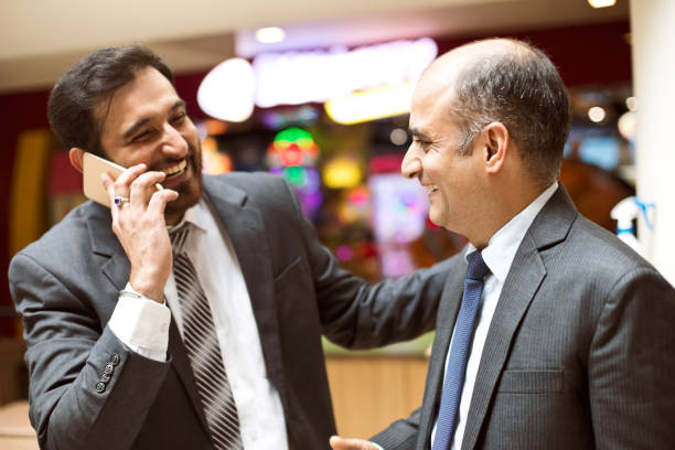 istock Businessmen talking on mobile phone 1029662260