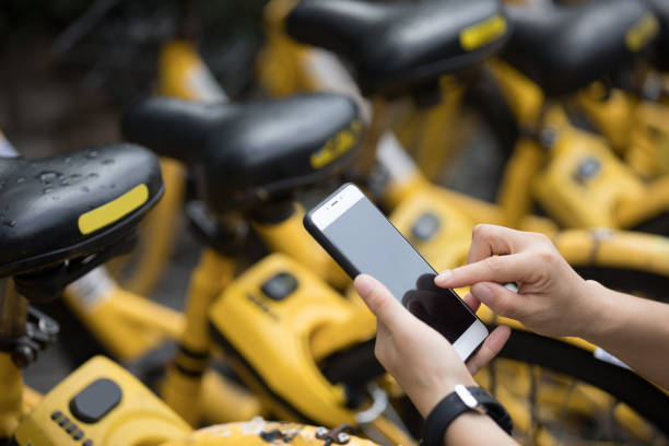 istock People hands using smartphone scanning the QR code of shared bike in city 1029663152