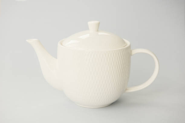 istock Pure white teapot on grey background. Close up 1029669170