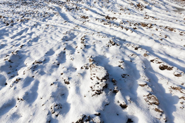 istock field with snow, the track 1029671572