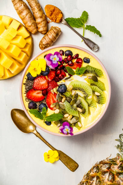 istock Mango banana pineapple turmeric smoothie bowl 1029692172
