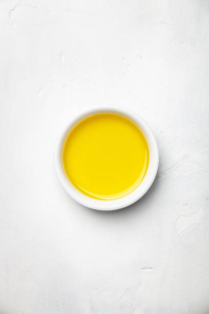 istock Olive oil on white stone background 1029692184