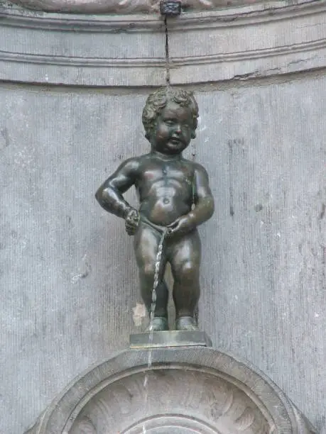 Peeing boy statue