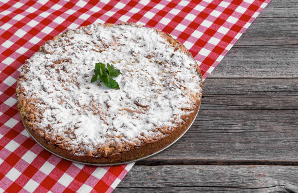 istock Homemade cake on a checkered tablecloth. Close-up. 1029704720