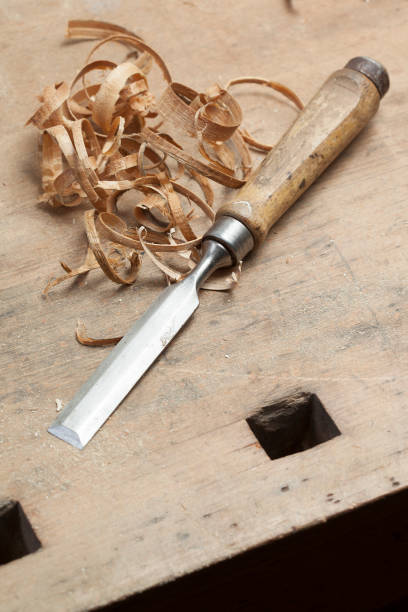 istock chisel an sawdust on wooden board.copy space 1029716924