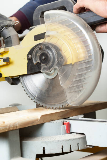 istock carpenter cutting with electric sawdust 1029716970