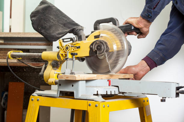 istock carpenter cutting with electric sawdust 1029716978