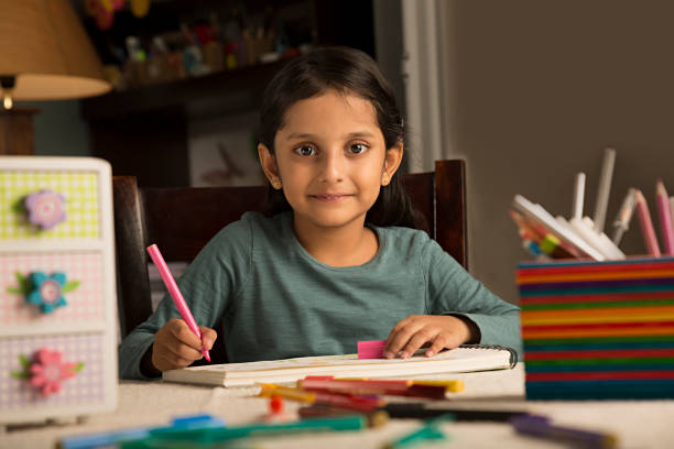 istock Girl doing homework - Stock image 1029720388