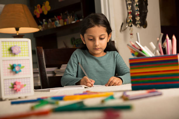 istock Girl doing homework at home - Stock image 1029720608