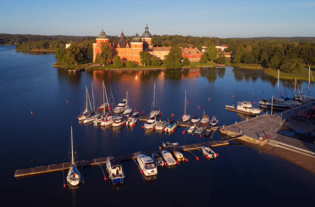 Aerial view of the Gripsholm castle Mariefred, Sweden - August 18, 2018: Aerial view during the morning lights of the marina and the 16 th century Gripsholm castle located at lake Malaren in the Swedish province of Sodermanland. mariefred stock pictures, royalty-free photos & images