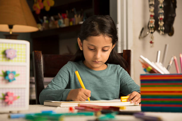 istock Girl doing homework - Stock image 1029723492