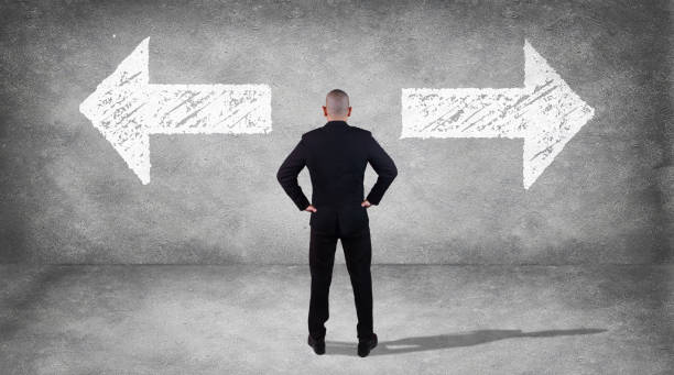 istock Businessman Confuse to Choose Direction 1029723774