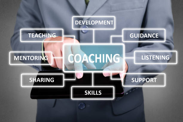 Coaching in Business Concept Business Concept. Businessman click coaching button on his tablet. Coaching strategy scheme diagram. Text typography design trainer stock pictures, royalty-free photos & images