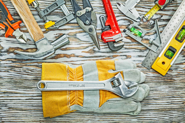Construction tooling for house repairing on wooden board.