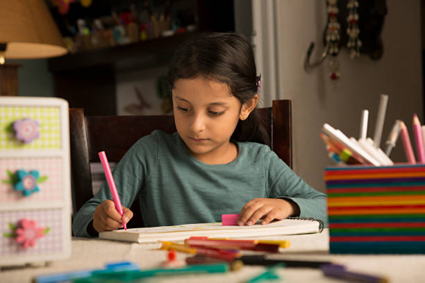 istock Girl doing homework - Stock image 1029731246