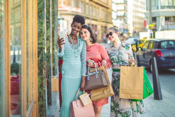 istock Friends are window shopping and taking selfies 1029735012