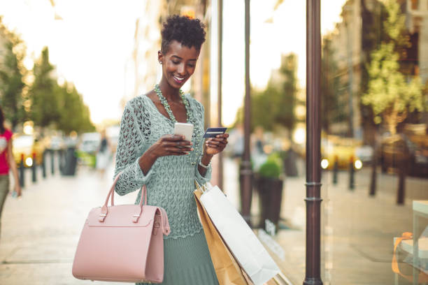 istock Young woman is window shopping 1029735334