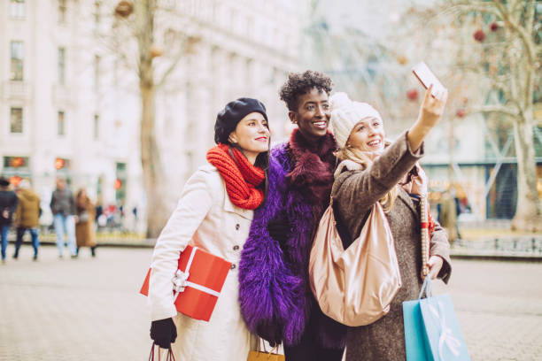istock Friends are taking a selfies with Christmas presents 1029735762