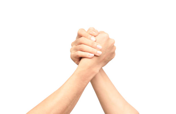 male and female arm wrestling on the white background - arm wrestling imagens e fotografias de stock