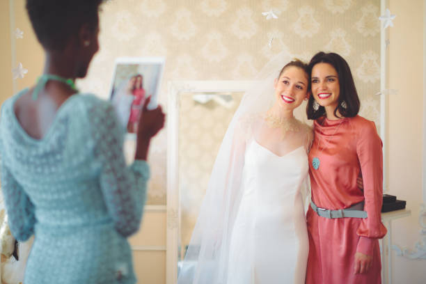 istock The bride is trying on her wedding dress 1029738902