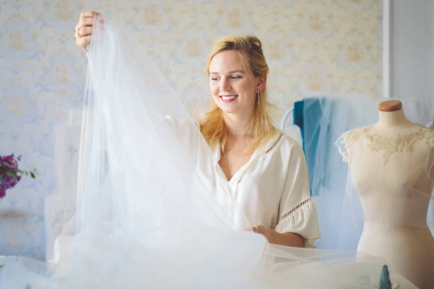 istock Fashion designer is working with veil 1029739176