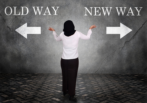 Dilemma in business concept. Businesswoman confuse to choose old way or new way