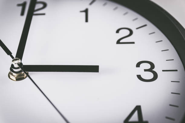 istock Close up of black and white analog clock with selective focus at 3 Oclock 1029750378