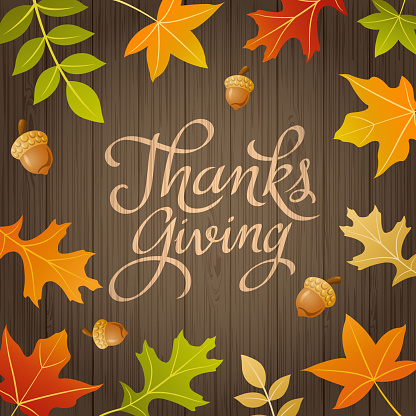 Celebrate and gather together at the Thanksgiving day with autumn leaves on the wood background